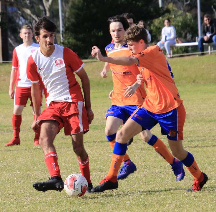 QUICK FEET: St Georges Basin Dragons' Beau Locke Williams gets a pass away against the Culburra Cougars during Saturday's reserve grade fixture at Culburra Oval. Photo: Tamara Lee