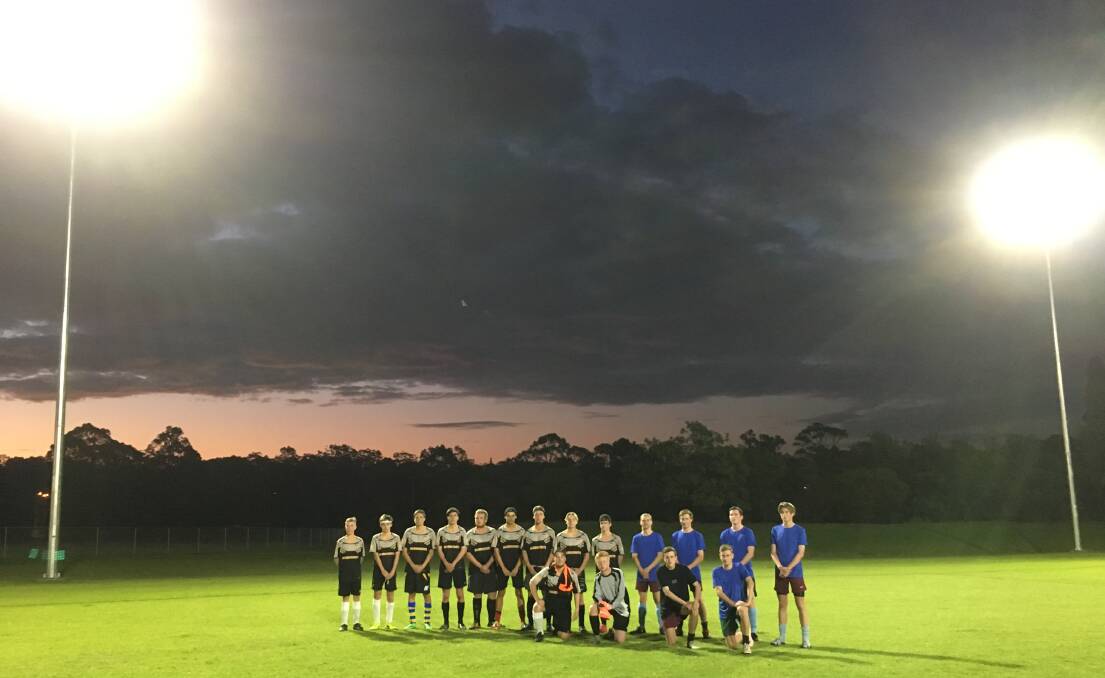 MAY THERE BE LIGHT: The under 17 teams Arsenal and Bandicoots teams before their game on the Wednesday night at Ison Park, South Nowra.