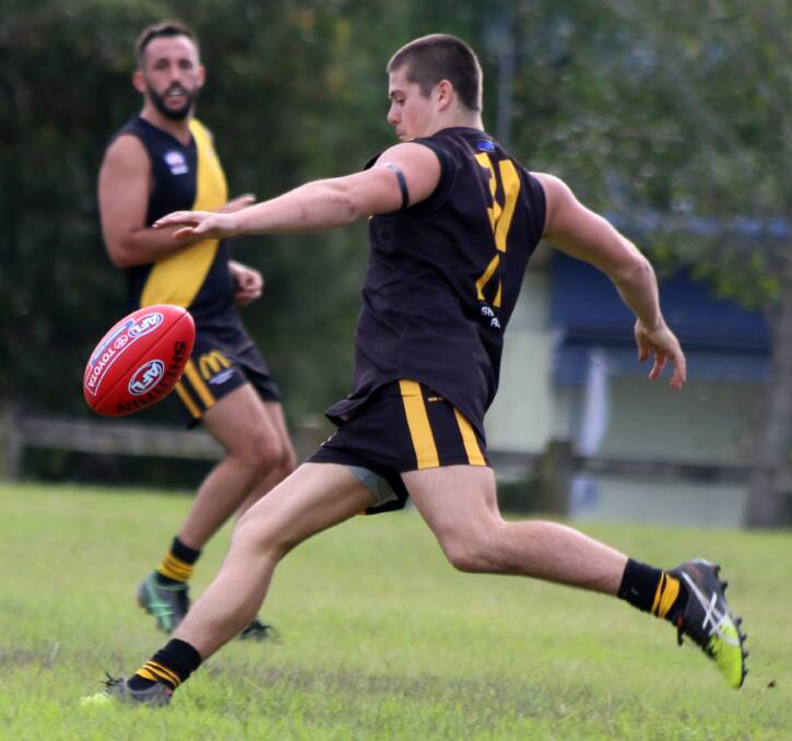 MAN ON A MISSION: Bomaderry Tigers on-baller Tyson Sue sets himself for a kick against the Figtree Kangaroos at Artie Smith Oval, as Jacob Wright looks on. Photo: CATHY RUSSELL