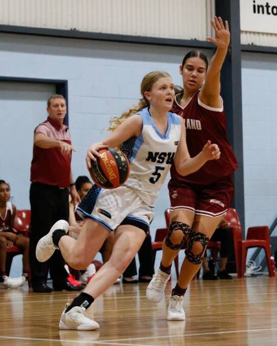 NSW Country's Asha Phillips drives to the basket against Queensland South. Photo: BNSW