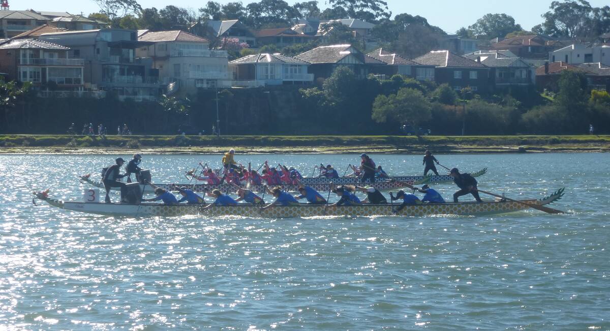 Teamwork: Nowra women’s team on their way to victory in the second heat
