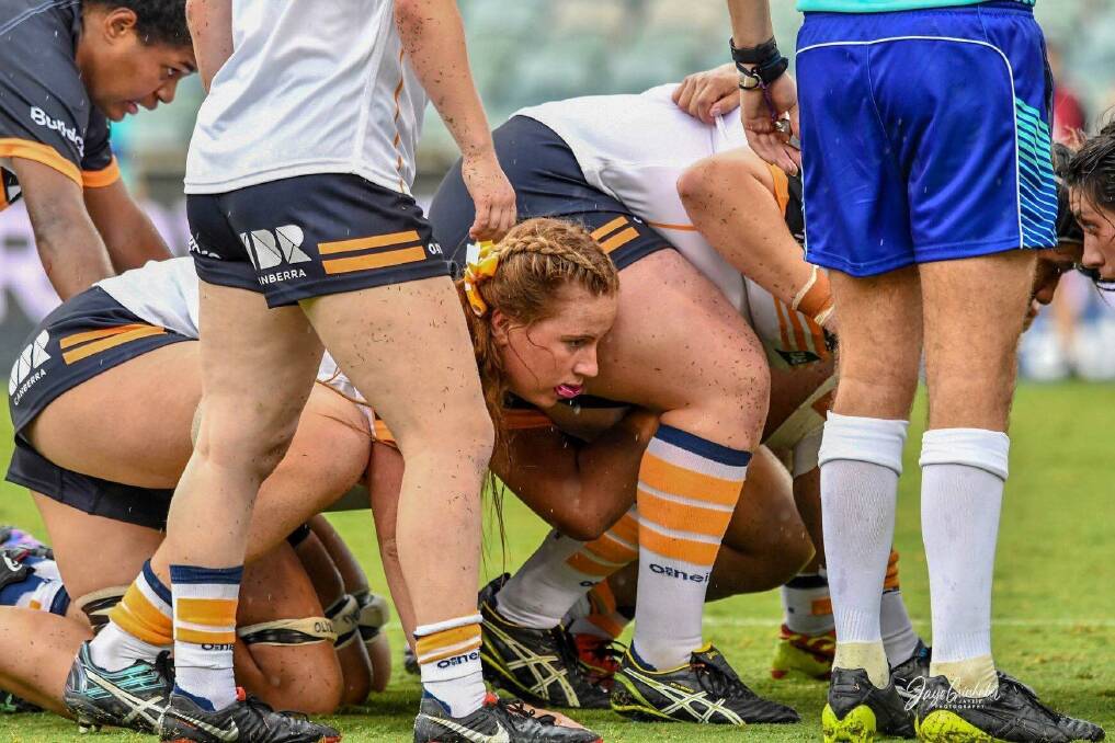 Narrawallee's Grace Sullivan (pink mouthguard) packs down in a scrum for ACT. Photo: BRUMBIES RUGBY
