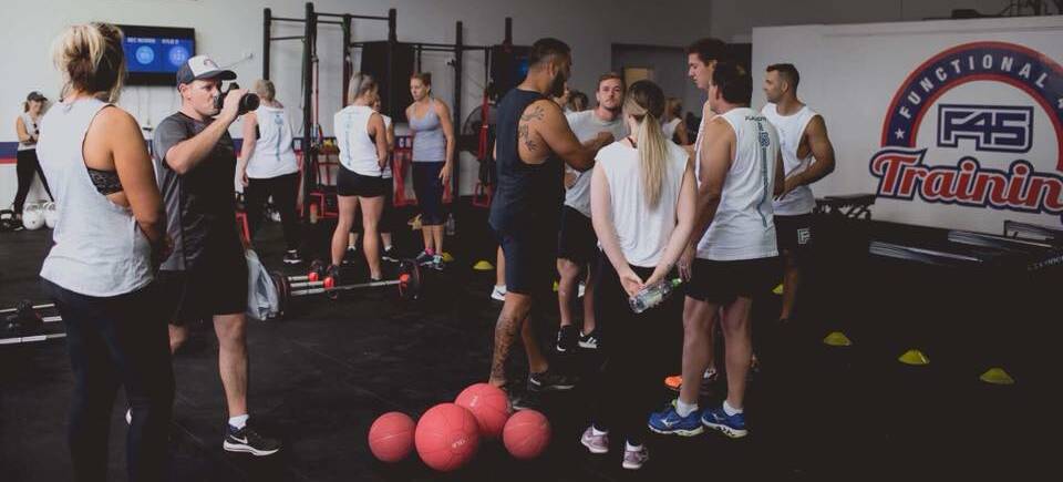 Dylan Farrell (navy singlet) runs a session at his Nowra F45 Training gym prior to the COVID-19 shutdown. Photo: SUPPLIED