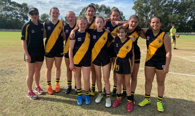 Lyn Robinson and her Bomaderry Tigers under 15 girls side. Photo: Supplied
