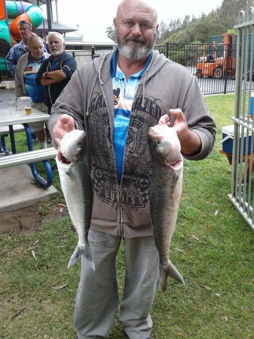 SOLID CATCH: Scott Danvers with his two Australian salmon.
