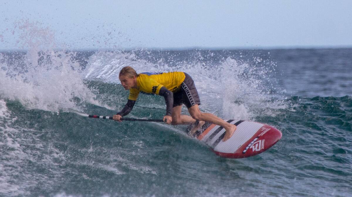 Mollymook's Kai Bates competes in the open men's SUP event. Photo: Josh Brown/Surfing NSW