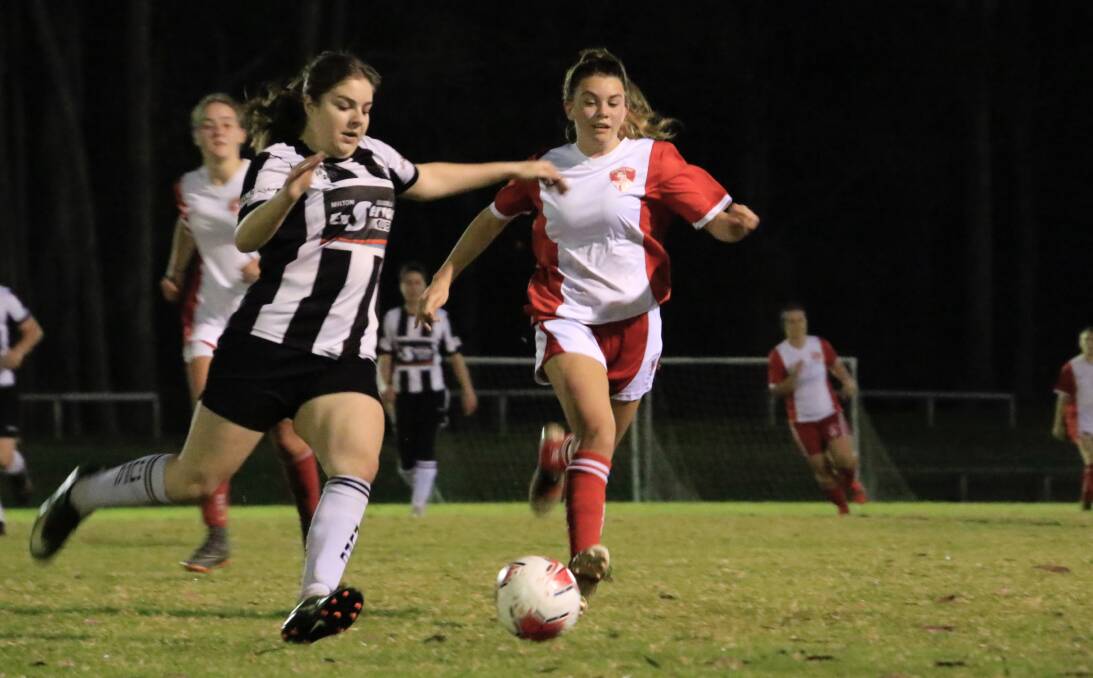 Milton-Ulladulla's Tylah Emslie and St Georges Basin's Ebony Smith attack the ball on Tuesday night at Ison Park. Photo: Tamara Lee