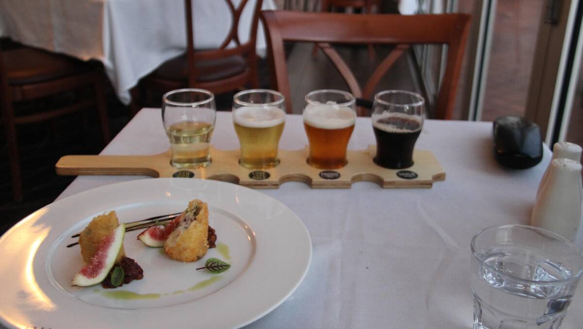  Great entrée and great accompanying drinks … goat-cheese log served with bacon jam prepared with the Sydney Brewery’s Paddo Ale, and a tasting paddle of fine beers. 