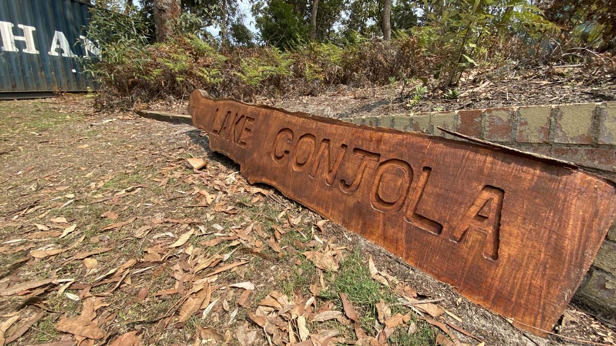PIC OF THE DAY: Sign of the times from burnt out tree. Email your photos to editor@southcoastregister.com.au