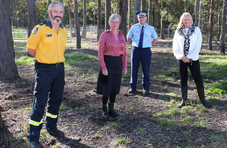 RECOGNISED: Kim White (far right) is congratulated by Rural Fire Service Superintendant Mark Williams, Shoalhaven City Council Mayor Amanda Findley and NSW Police Inspector Ray Stynes.