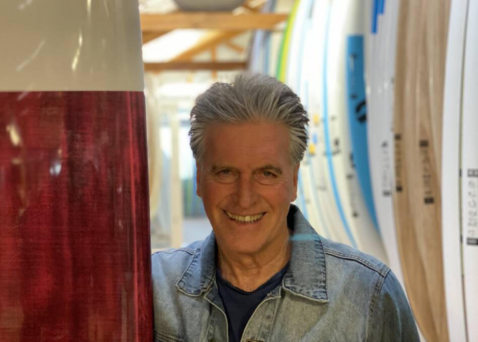 BEACH BREAK: Kent Ladkin from Natural Neccessity Surfshop at Gerringong says business, normally quiet in winter, is booming. Photo: John Hanscombe