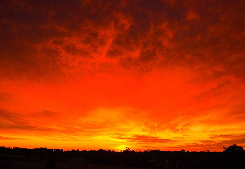 PIC OF THE DAY: Daniel Colebrook snapped this fiery sunrise at Yatte Yattah. Email your photos to editor@southcoastregister.com.au