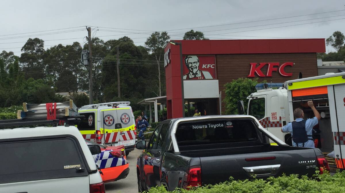 ACCIDENT SCENE: Police and Ambulance paramedics at the scene of the accident in South Nowra. Photo: Rebecca Fist