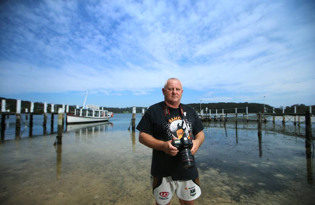 EXPOSED: Russell 'Whacker' Gotsalks, who runs a photographic framing business in Narooma, has been impacted by the absence of tourists. Photo: Sylvia Liber. 