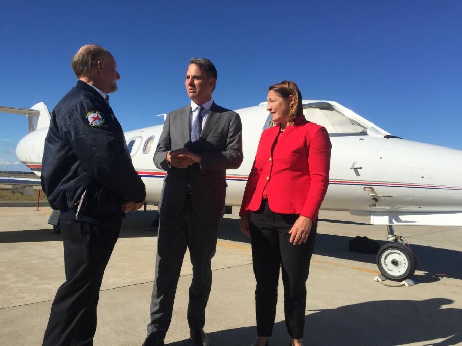 DEFENCE PROMISE: Air Affairs Australia CEO Chris Sievers, Shadow Defence Minister Richard Marles and Labor candidate for Gilmore Fiona Phillips in Nowra on Tuesday.