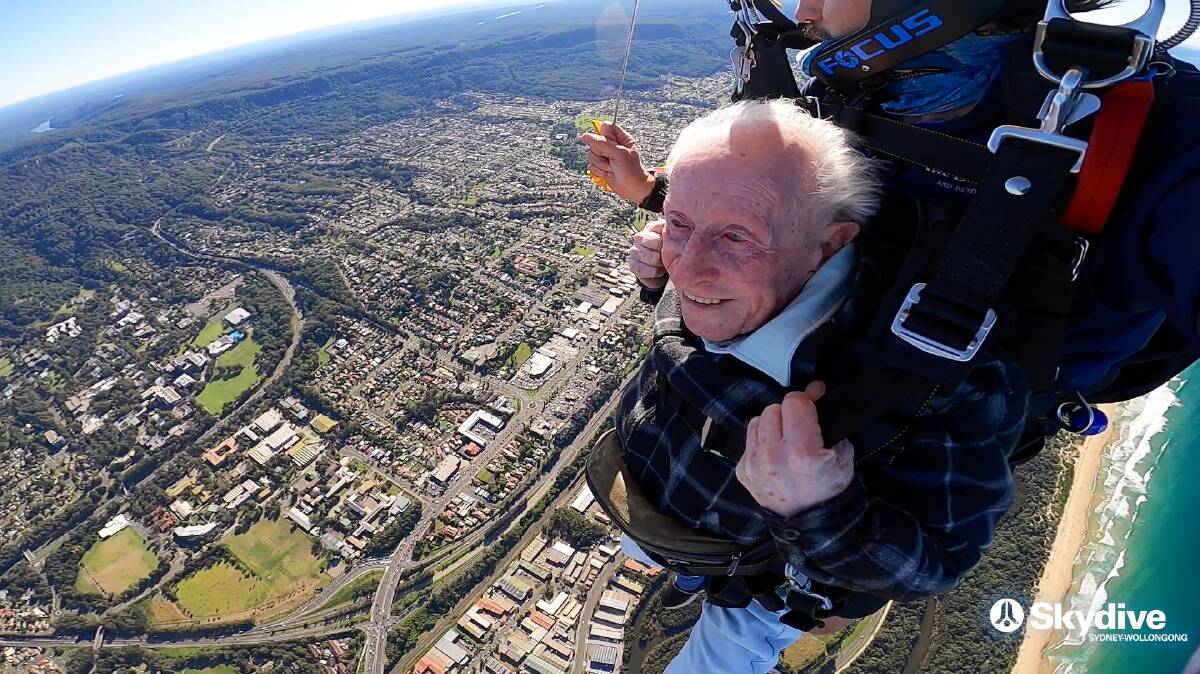 HIGH ADVENTURE: George Coghlan, 90, enjoys the view of Wollongong on his recent skydive. He says he'd do it again just to enjoy the sights. Photo: Skydive Sydney-Wollongong.