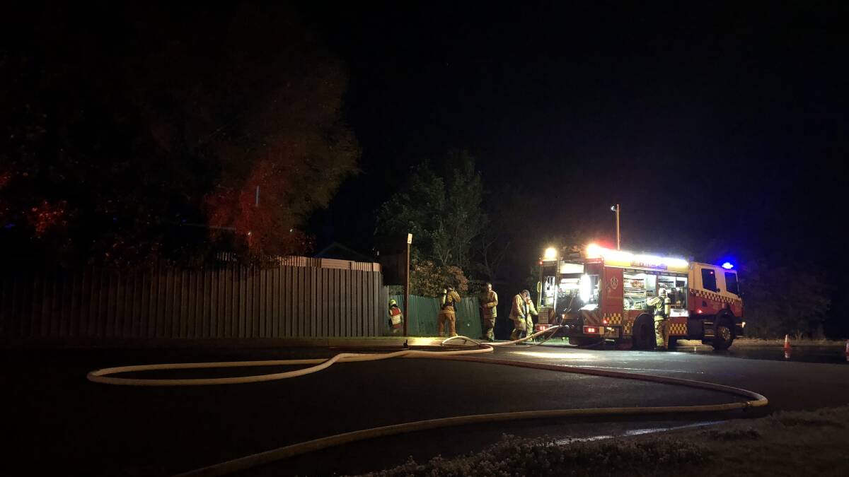 Firefighters enter the Riverhaven Motel on Scenic Drive late on Monday night.
