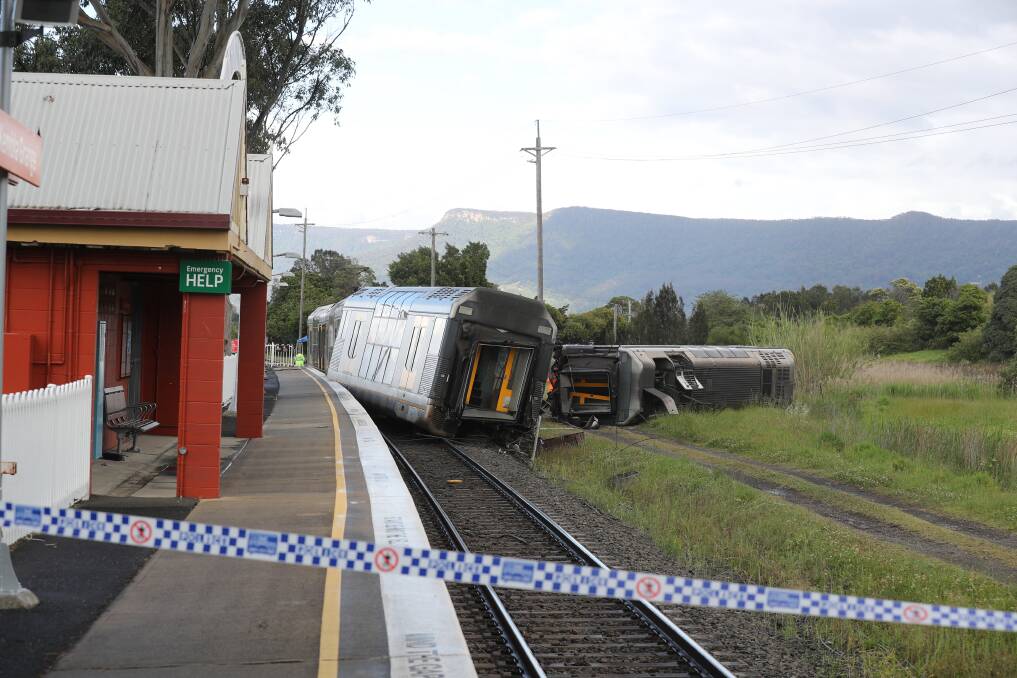 Repairs: The train derailment at Kembla Grange on Wednesday will see the section of the South Coast line closed for days. Photo: Robert Peet
