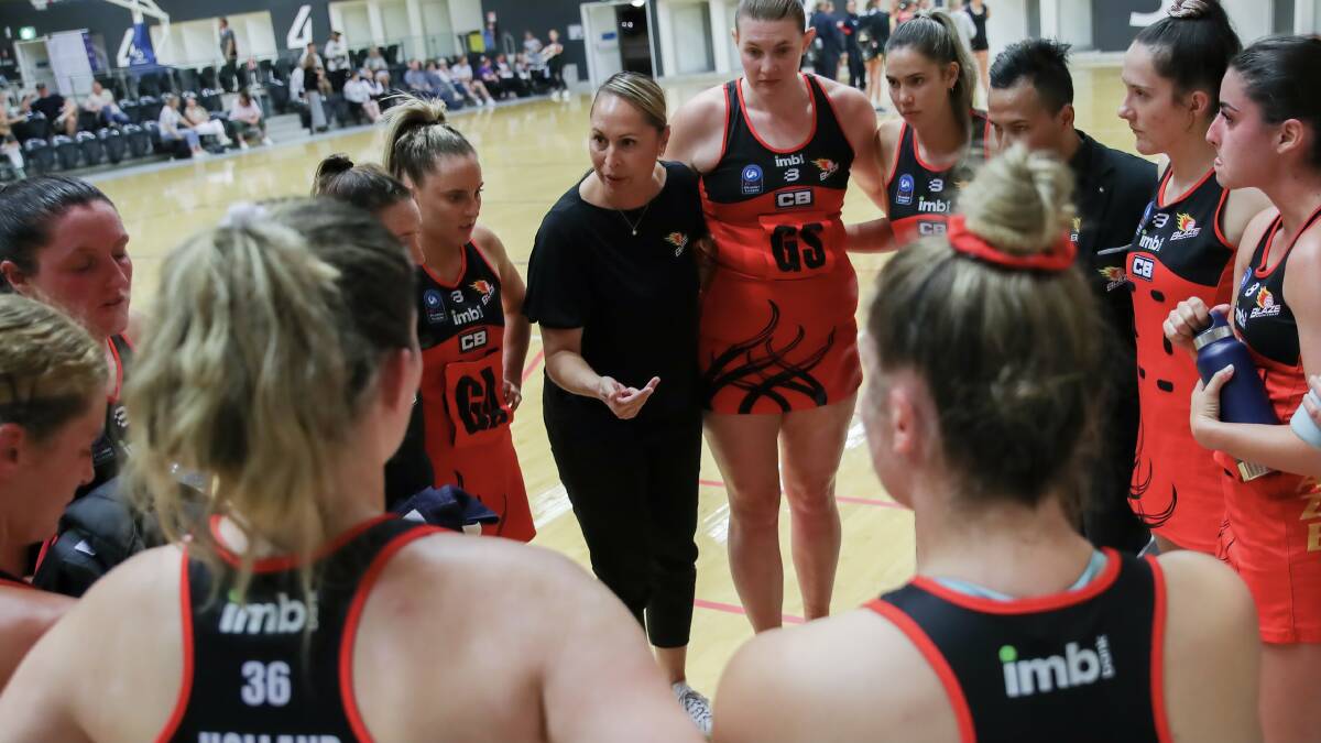 Blaze coach Marji Parr (centre) gives instructions to her opens players during a game this season. Photo: May Bailey/Clusterpix Photography