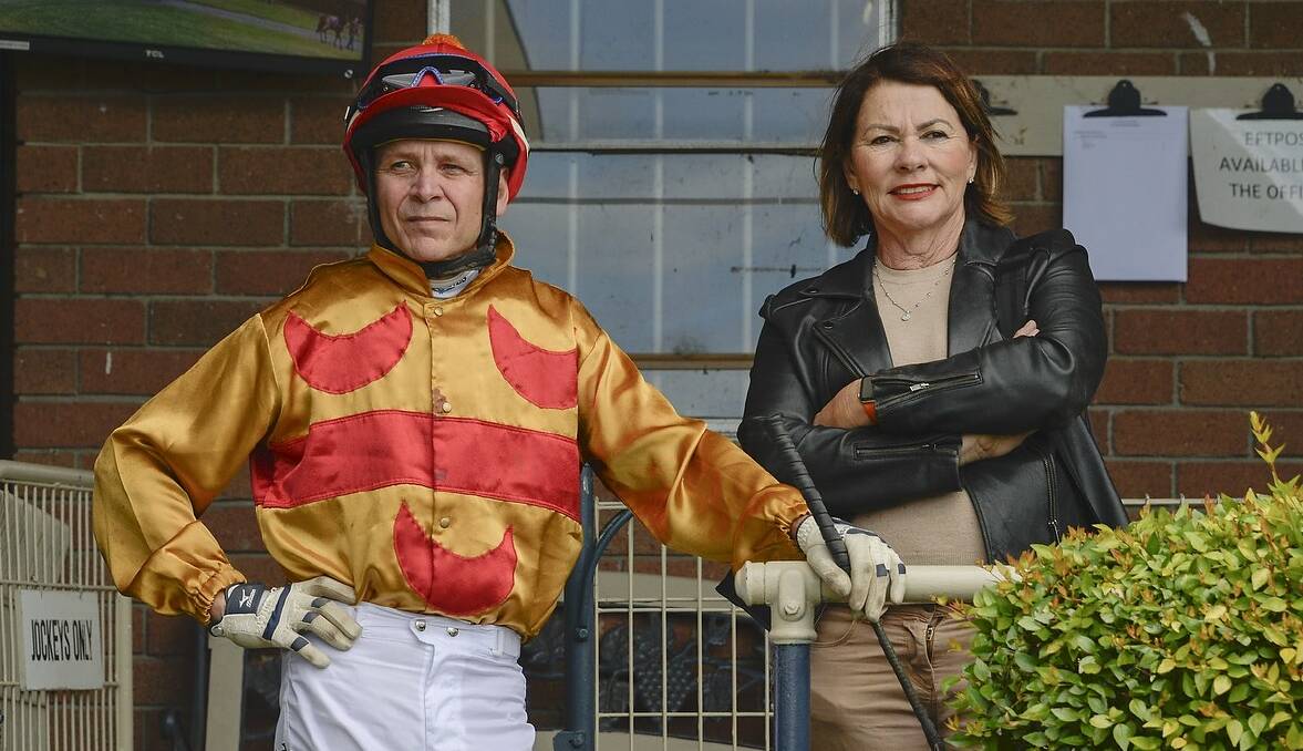 PREPARED: Berry trainer Cheryl Roberts chats with jockey Troy Phillips at Nowra last week. Photo: BRADLEYPHOTOS.COM.AU