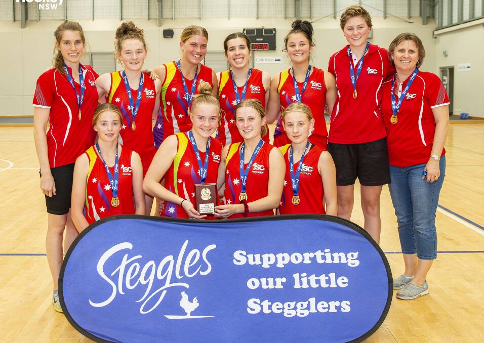 Kyah Gray (back left) and her victorious Illawarra South Coast under 18s indoor hockey team on Sunday. Photo: Greg Thompson/Click InFocus