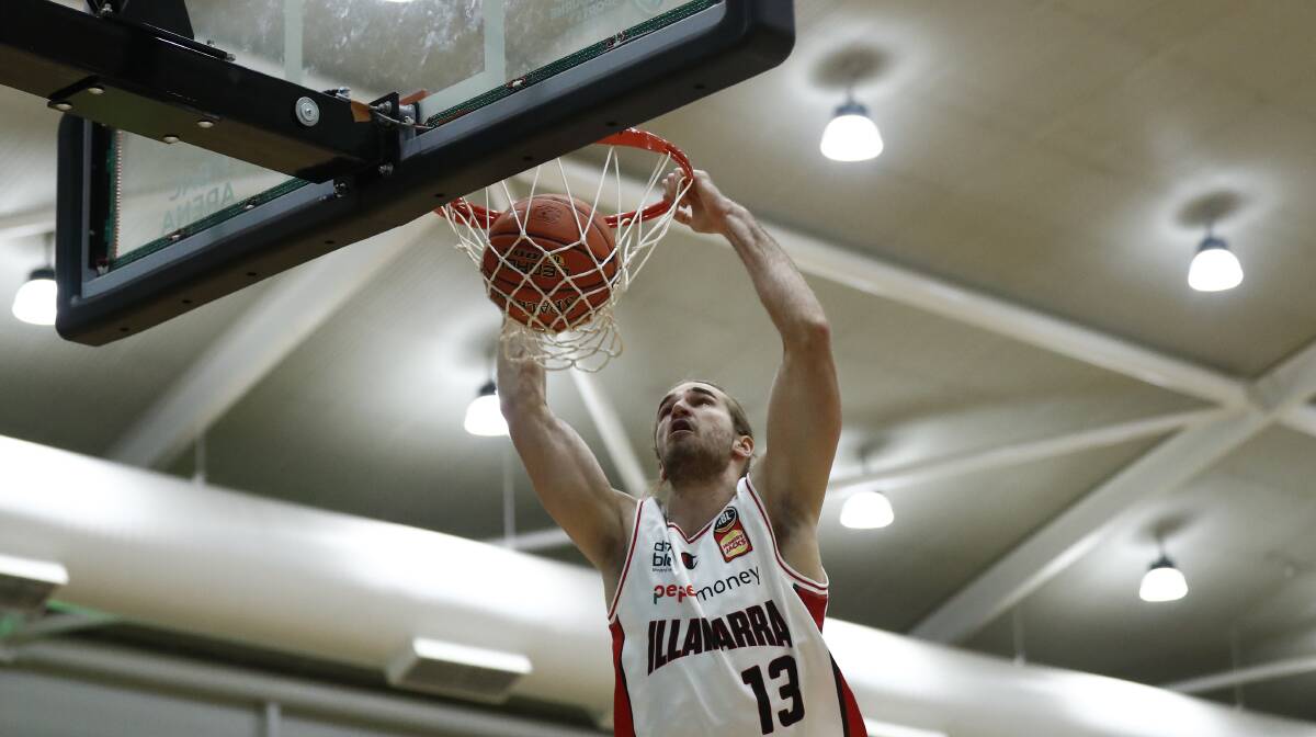 Sam Froling of the Hawks dunks against the Phoenix on Monday night. Photo: Darrian Traynor