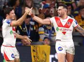 STICKING TOGETHER: Ben Hunt and Jack Bird celebrate after scoring a try against the Eels in round four. Picture: Mark Kolbe/Getty Images
