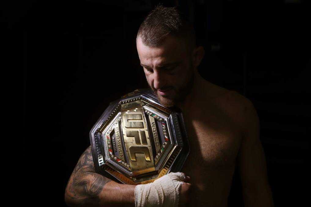 DELIVERED: Alex Volkanovski, sporting a suspected broken hand, proudly holds the UFC Featherweight Championship belt. Picture: Sylvia Liber