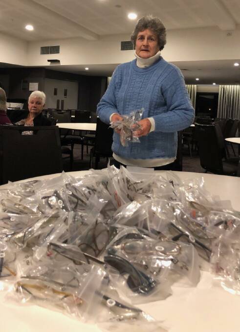 GREAT SIGHT: Nowra Lions member Margaret Bryatt with the donated glasses which will eventually be sent overseas.