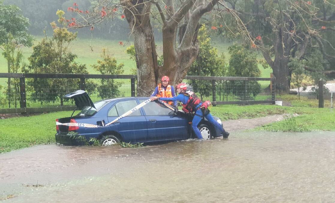 The Kiama flood rescue team save people from cars stuck in water. Picture: NSW SES Kiama Unit