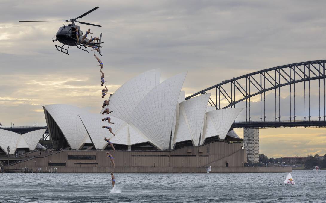 World champion Rhiannan Iffland takes the plunge out of a helicopter into Sydney Harbour on Wednesday. Pictures Red Bull Content Pool