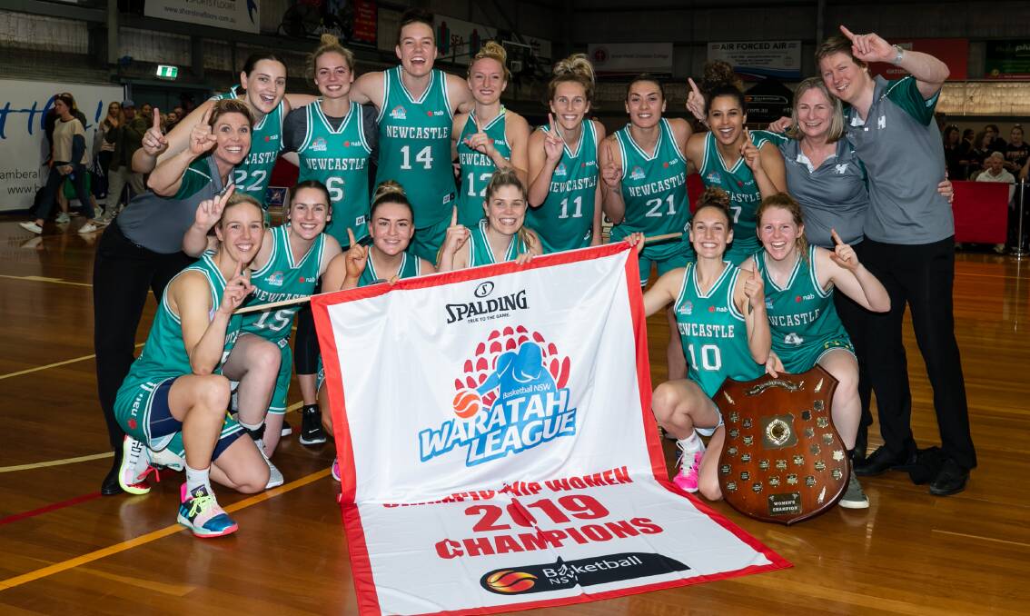 Jaimee Seebohm (front left) and her Newcastle Hunters celebrate after winning the Waratah Basketball League women's championship. Photo: Narelle Spangher/Basketball NSW