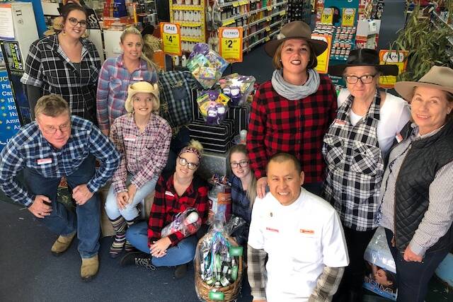 FUNDRAISER: Staff at Good Price Pharmacy. Back row: Marney, Rachel, Melissa, Tonia and Victoria. Front row: Paul, Darcie, Emma. G, Emma. S and James. Photo: supplied.