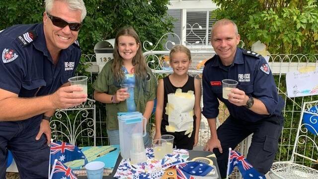 Nowra kids get behind the firies in a a time-honoured fashion, the old lemonadestall.