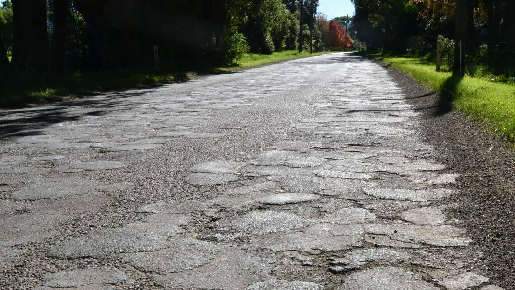BAD ROADS: Millbank Road between Greenwell Point and Terara roads in 2017. Patch upon patch, upon patch.