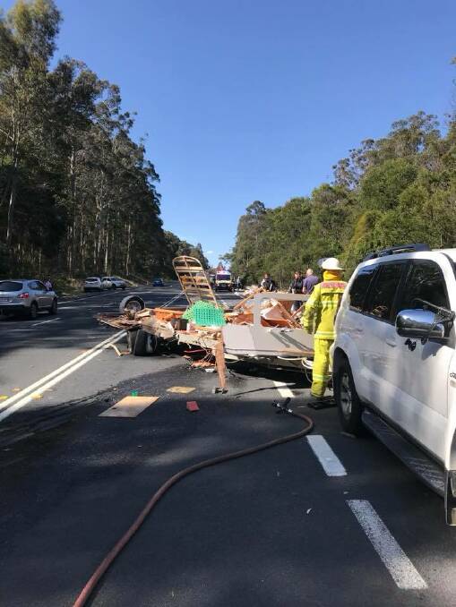 Scenes on the Princes Highway at Tomerong after a crash between two cars and a caravan. Photo: NSW Rural Fire Service St Georges Basin Brigade. 