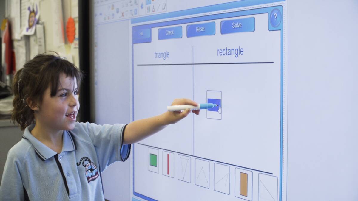 A Havenlee student using one of the new interactive boards, funded by Variety. 