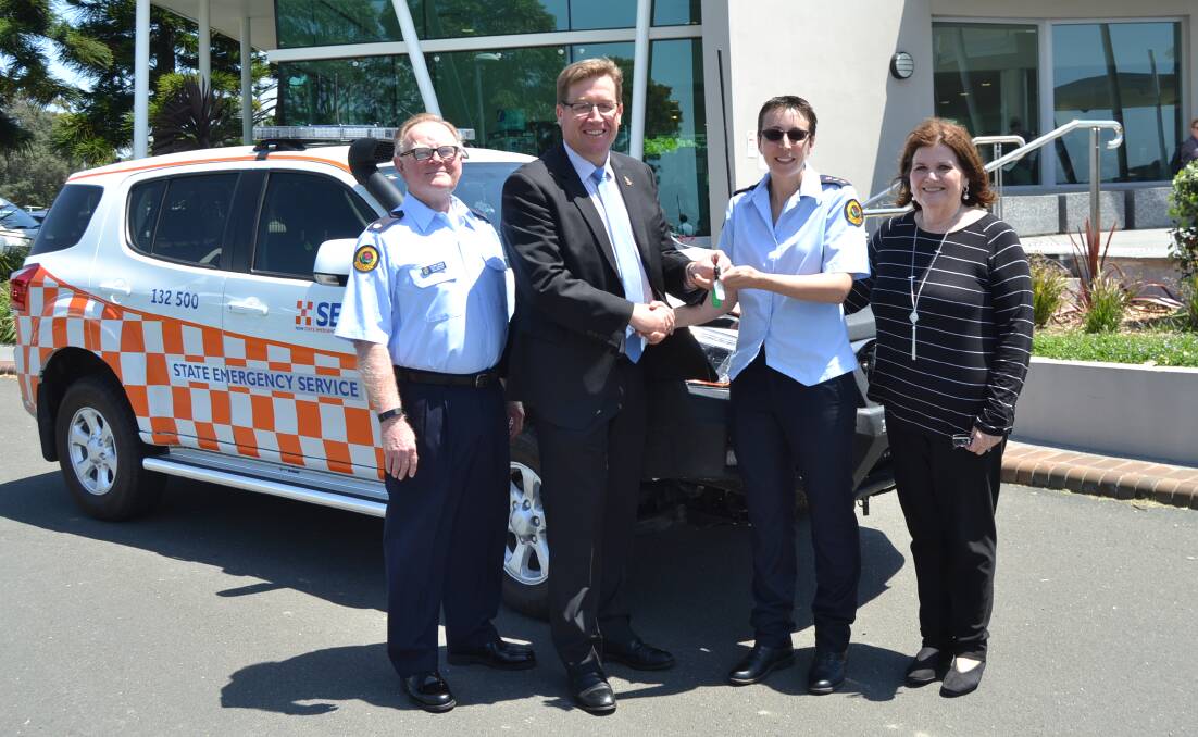 NEW VEHICLE: Minister for Emergency Services Troy Grant and South Coast MP Shelley Hancock handing the new vehicle over to SES St Georges Basin unit. Photo: Sam Strong.  