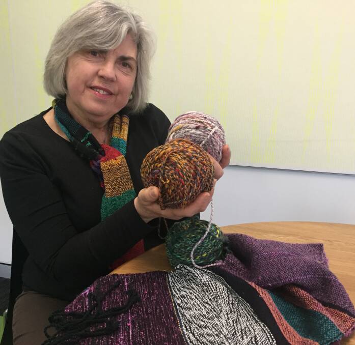 LATEST LOVE: Maggie Cooper with some of her Saori weaving and colourful wool. 