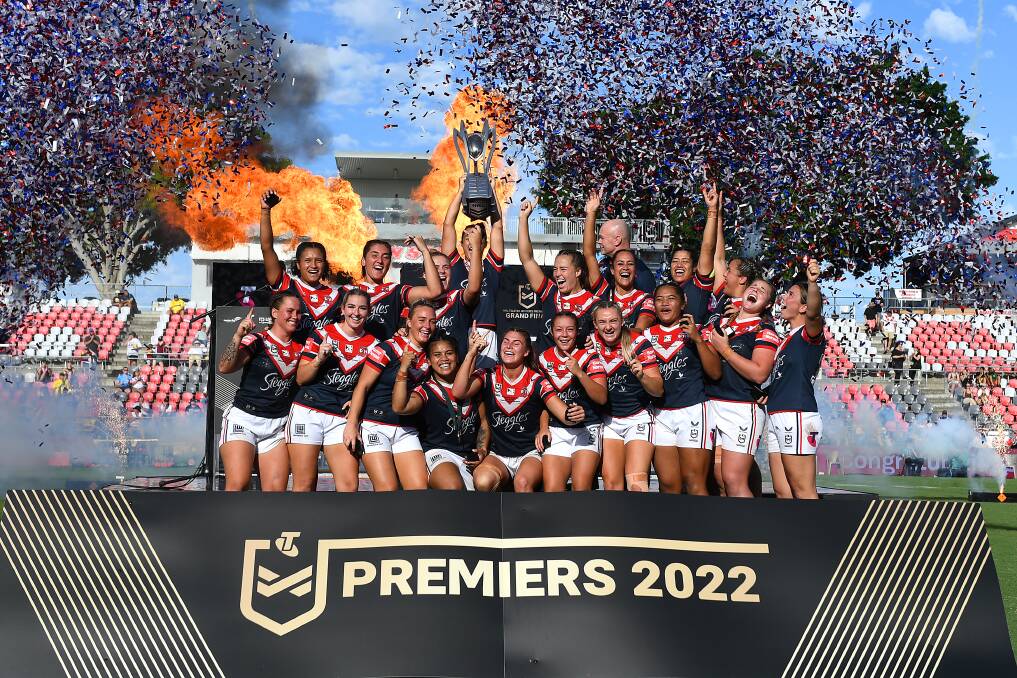 Celebrations: The Roosters hoist the NRLW trophy on Sunday afternoon. Picture: Albert Perez/Getty Images