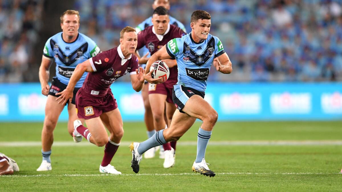 Breaking free: Nathan Cleary bursts through the Queensland defensive line. Picture: Robb Cox/NRL Imagery.