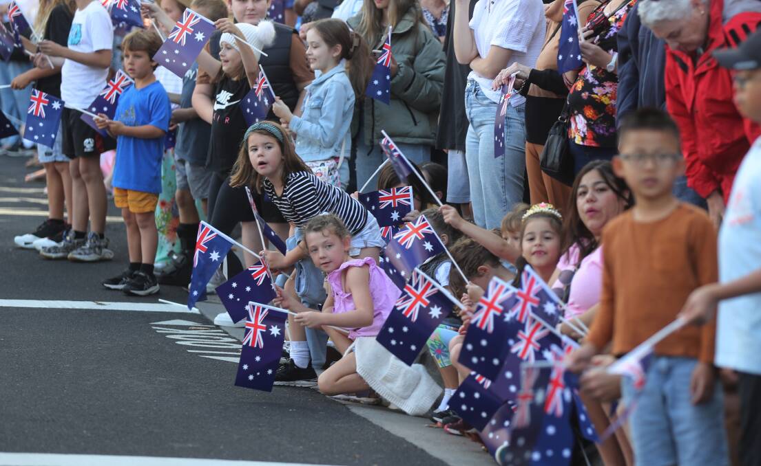 Esther Adamson 6 and Olivia Costello 6 from Russell Vale during the Anzac Day March. Picture by Robert Peet.