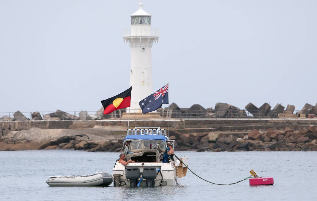 A boat in 2019 getting a prime spot for Wollongong's Australia Day fireworks, flying an Australian and Aboriginal flag. File picture by Adam Mclean