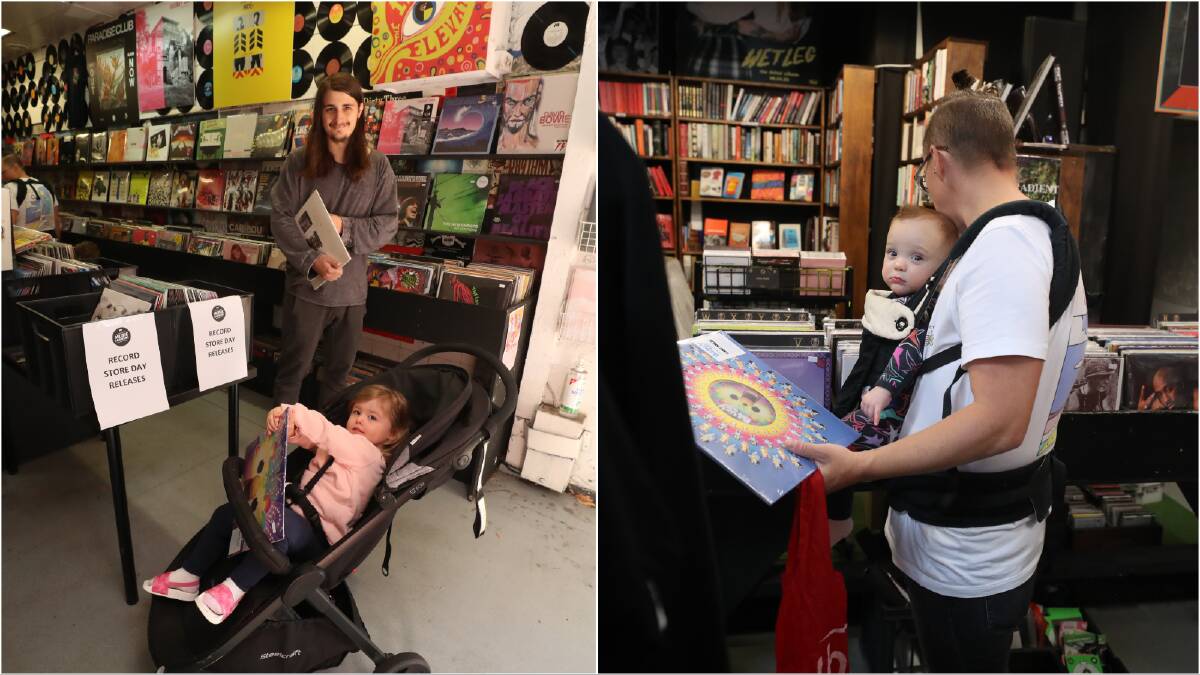 From her pram, toddler Amelia Agnez also got her hands on the prized record release, as did baby Maggie as she hung from mum Nat Lozen's baby carrier. Pictures by Robert Peet.