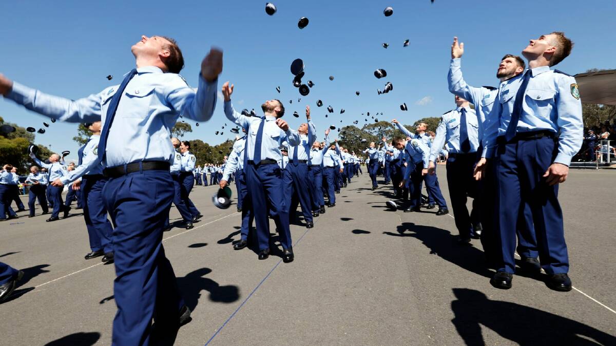 New probationary constables celebrate at the NSW Police Academy after their attestation ceremony last week. Photo NSW Police.