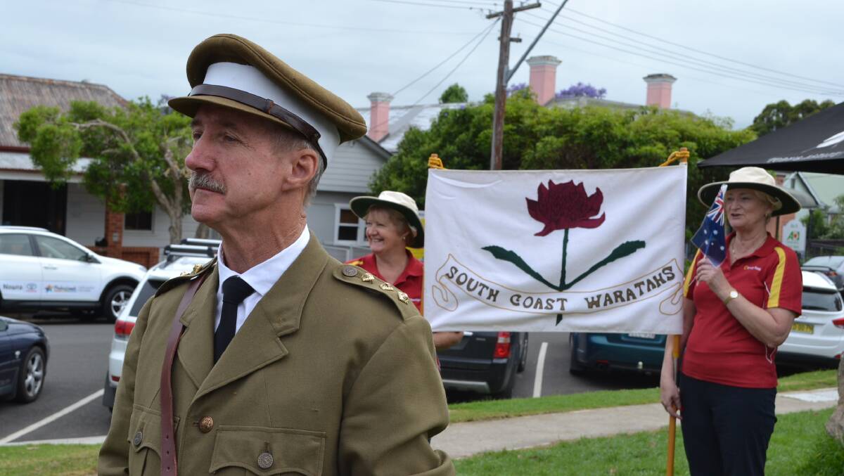 Clyde Poulton as captain Ernest Alfred Blow of the South Coast Waratah Recruitment March walks with Heather Darlington and Deb Parker from Bendigo Bank, Nowra ahead of the re-enactment ceremony. Photo: Jessica Long
