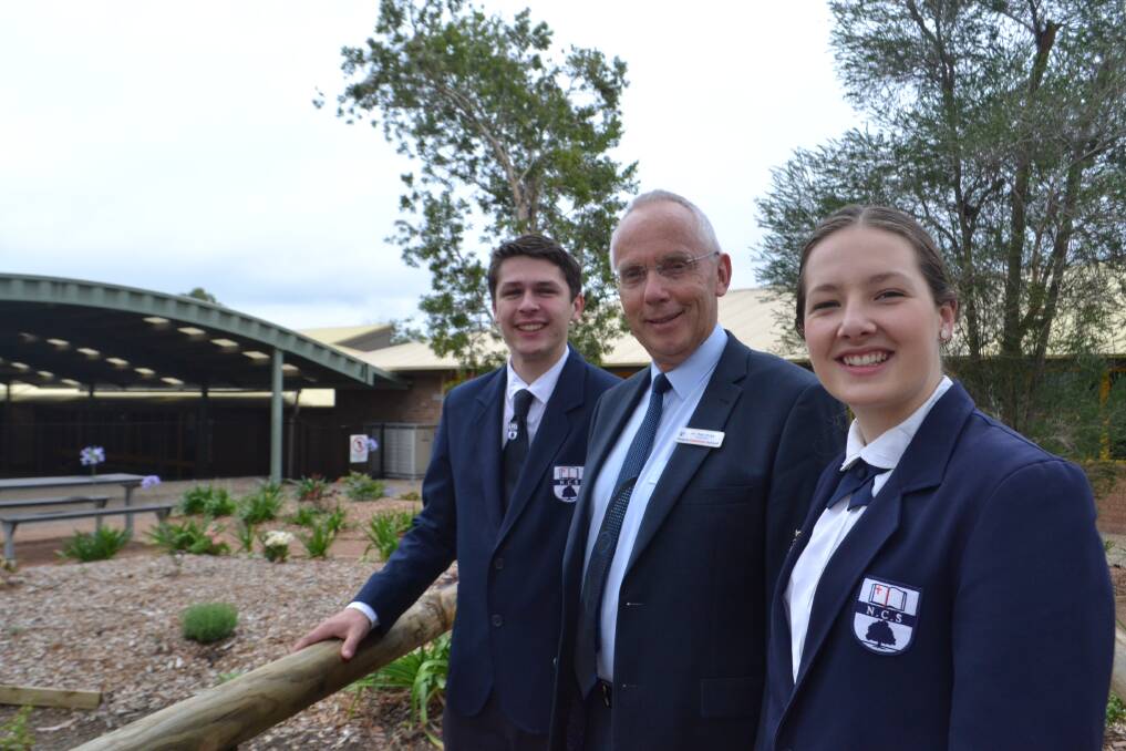 Nowra Christian School 2018 Captains Caleb Mackie and Jasmine Dickinson with Headmaster Rob Bray on Friday. Picture: Rebecca Fist