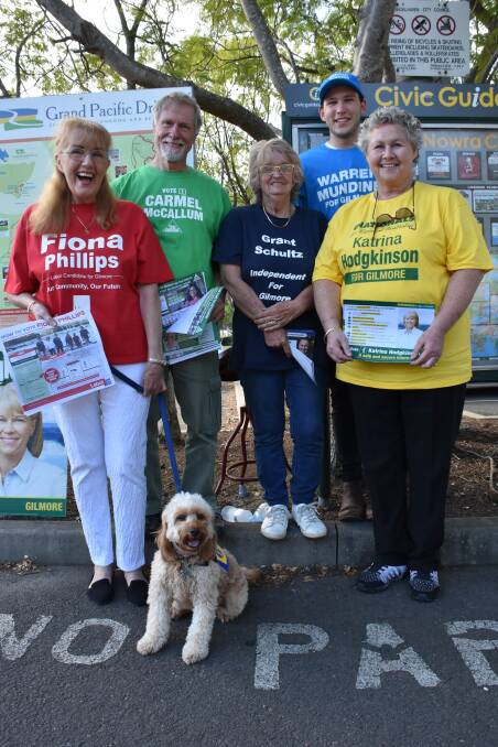 VOLUNTEERS: Lesley Zandstra, Terry Barratt, Kay Johnson, Jesse Martin and Cheryl Broadhurst with Milly the dog at the Nowra pre-poll booth on Monday. Picture: Rebecca Fist