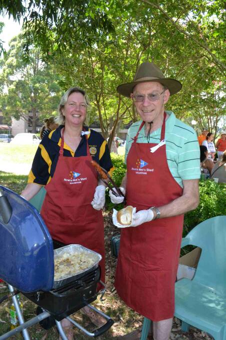GOOD CAUSE: Honorary Men’s Shed member Fiona Kibble and Nowra Men’s Shed member Vern James volunteering at a White Ribbon event in 2014. Picture: Damian McGill