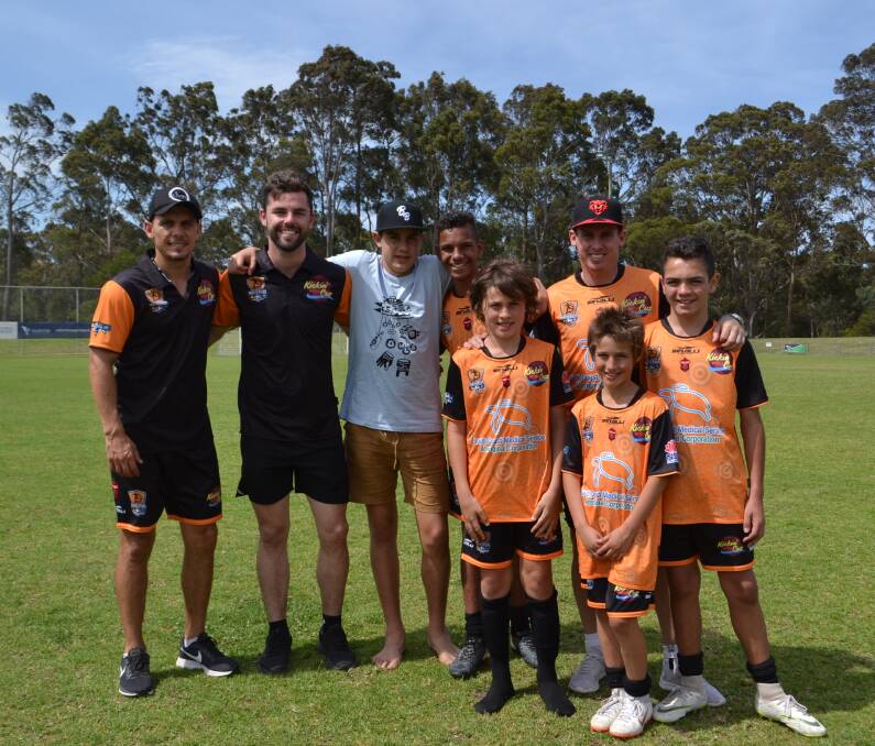 Brisbane Roar player Jade North, former Socceroos great and Wollongong Wolves coach Luke Wilkshire with National Indigenous Games players Kyan Werner, Tahj Werner, Taylor McDonald, Matthew Flanagan, Kaani Slockee and Quooyarm Dingo-Donovan in South Nowra on Friday. Picture: Rebecca Fist